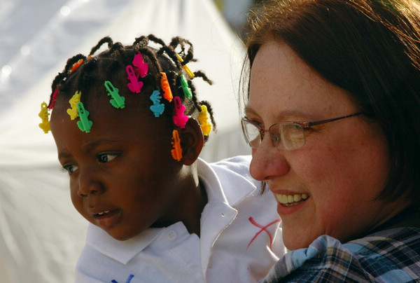 Haitian orphans join adoptive French families