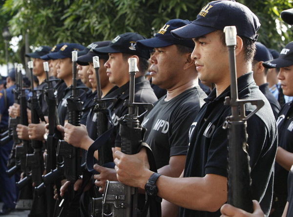 Manila police tape their guns for safety