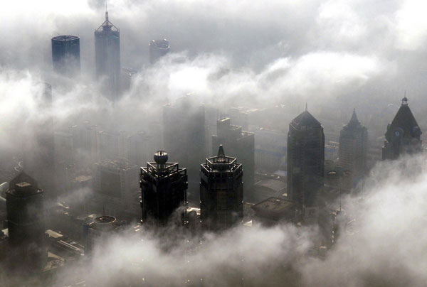 Fog clouds Shanghai's skyscrapers