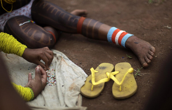 Body painting for Kayapo people in N Brazil