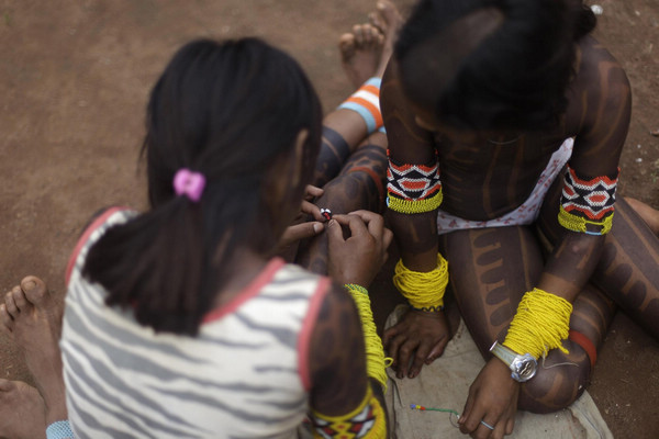 Body painting for Kayapo people in N Brazil