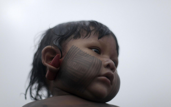 Body painting for Kayapo people in N Brazil