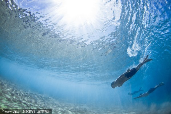 Swimmers battle power of ocean