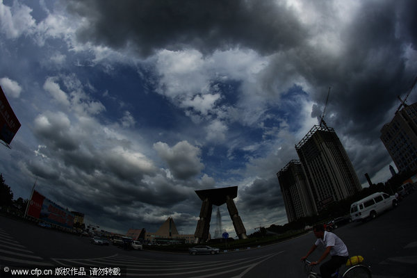 Thick clouds shield city from scorching sun