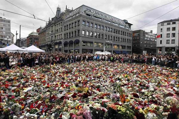 Sea of flowers marks vigil for twin attack victims