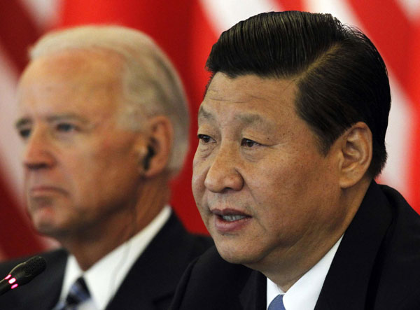 Xi, Biden talk business issues in Beijing