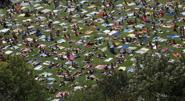 People out for sunbath in Prague