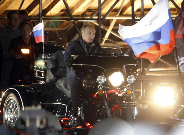 Putin rides with 'Night Wolves' at bike festival