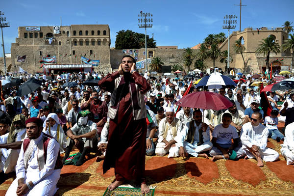 Libyan Muslims pray at Martyr's Square