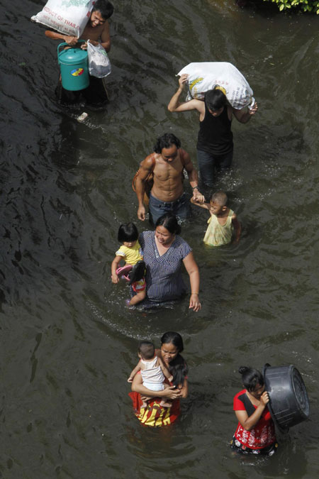 Floodwater forces evacuation in Bangkok's suburb