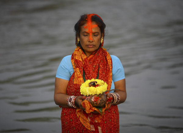 Hindu devotees pray to Sun god