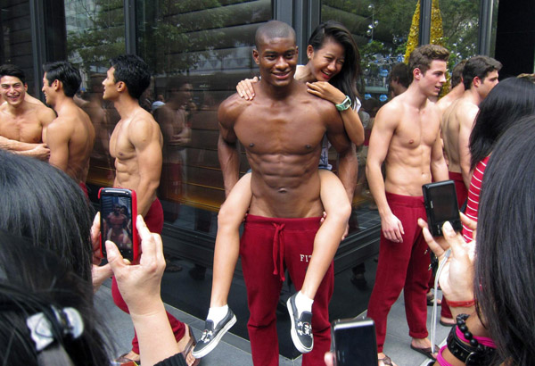 Shirtless men at Singapore's shopping district