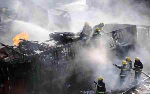 One dead after eight trucks blaze