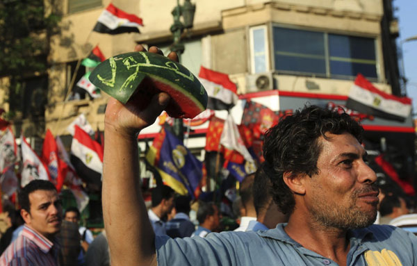 Supporters of Morsy protest against army in Cairo