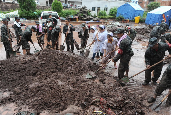 Floods pummel quake-hit county