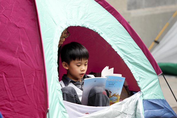 Parents pitch tents for school break time