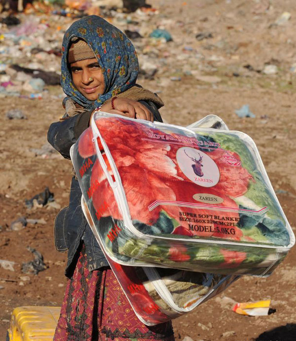 Afghan people receive winter relief assistance