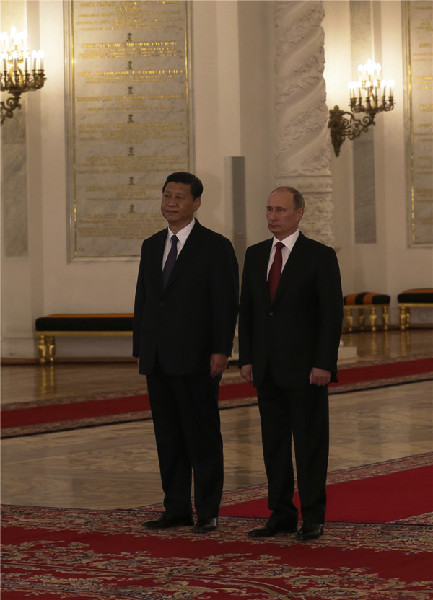 Visiting Chinese President Xi welcomed by Putin