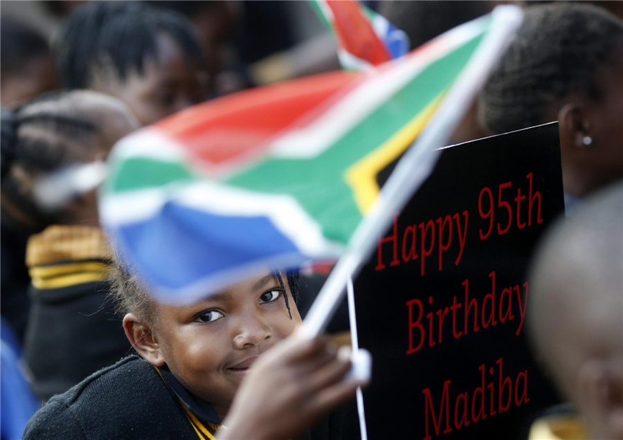 'Improving' Mandela marks 95th birthday