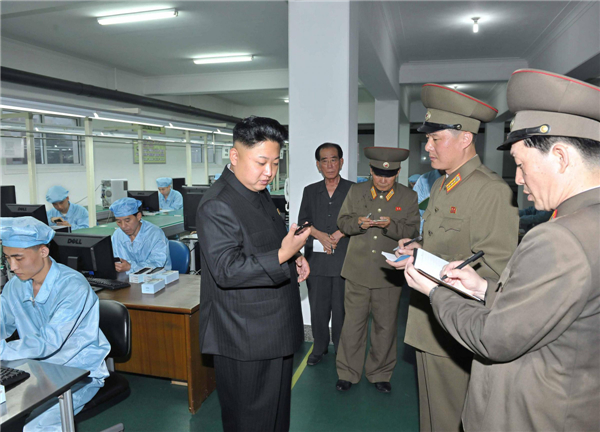 Kim Jong-un visits mobile phone factory