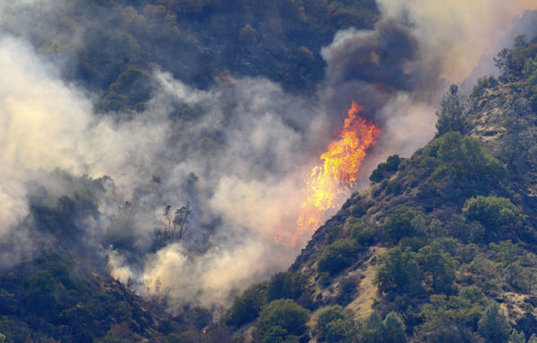 Fire rages through California park