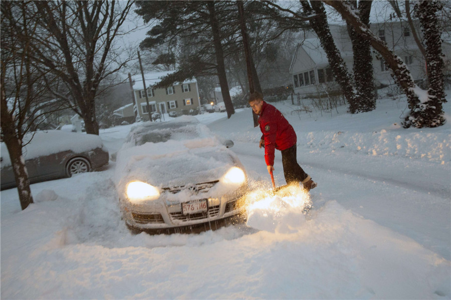 Bitter cold lingers as NE US digs out from snow