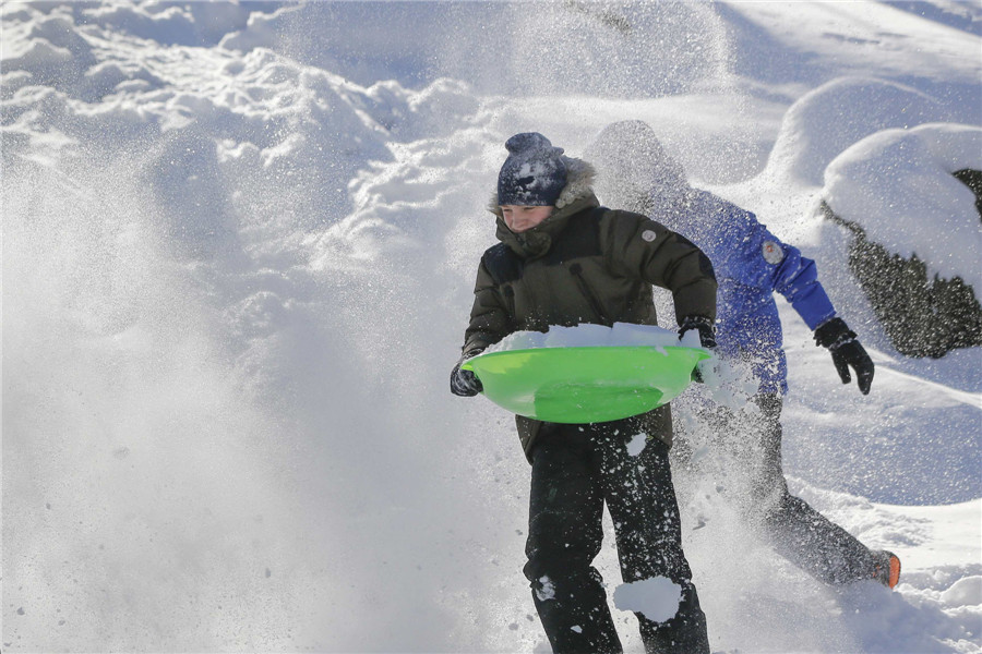 Bitter cold lingers as NE US digs out from snow