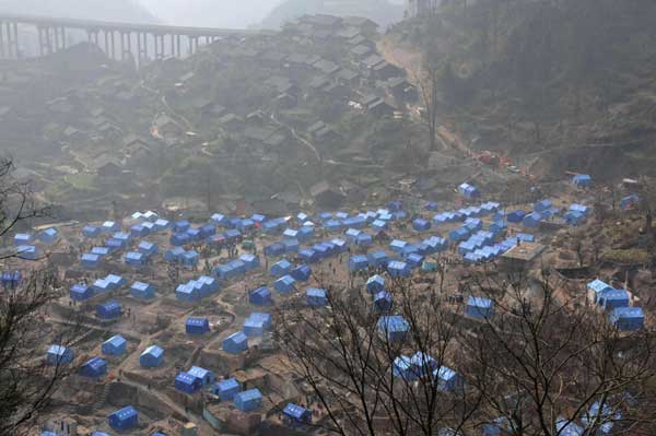 Relief work after fire in ancient village