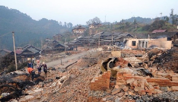 Relief work after fire in ancient village