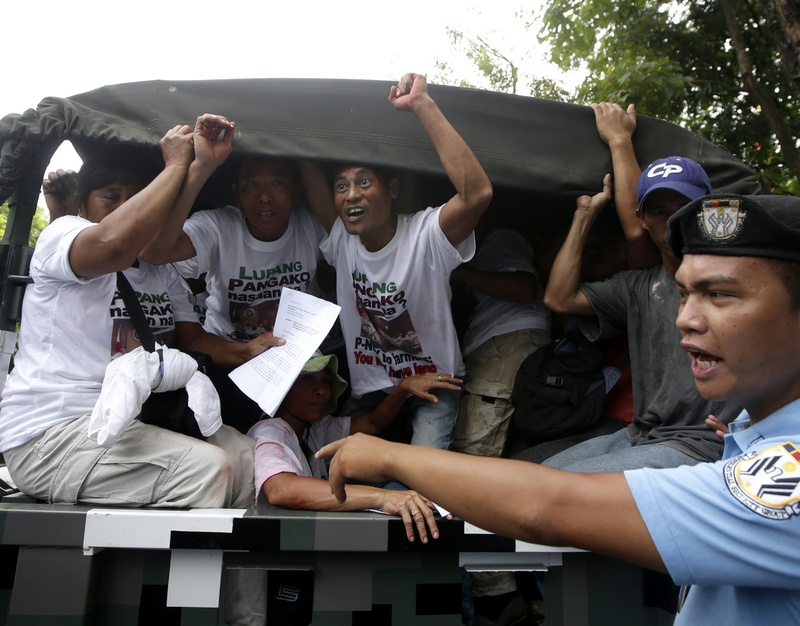 Farmer-protesters sneak into the Malacanang Palace in Manila