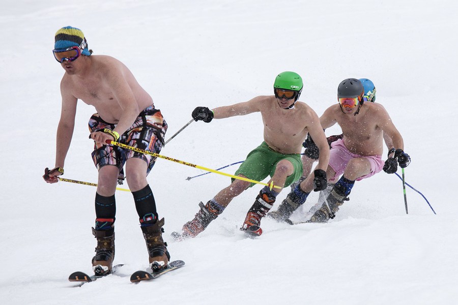 Skiing and snowboarding in bikinis and shorts