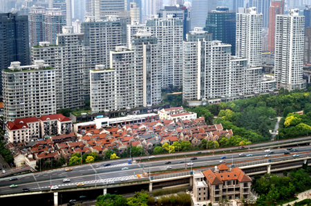 Beijing cuts rates, taxes to boost housing