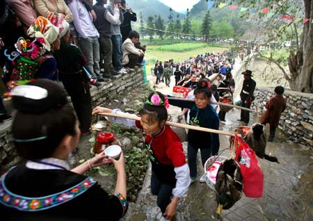 Ethnic Miao people celebrate Guzang Festival