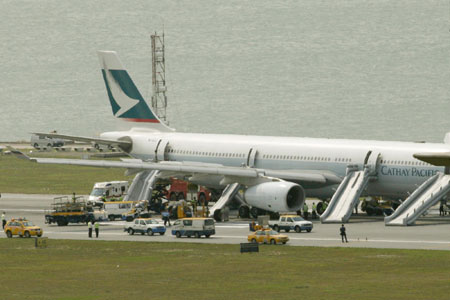 Tyre on fire as plane lands in HK, 7 injured