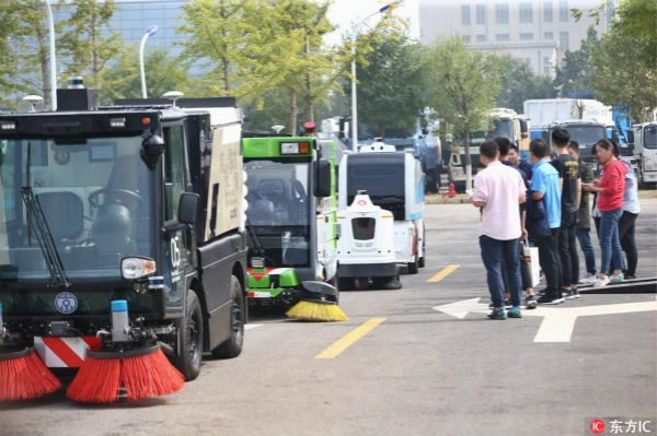 Autonomous driving sanitation vehicles unveiled in Beijing