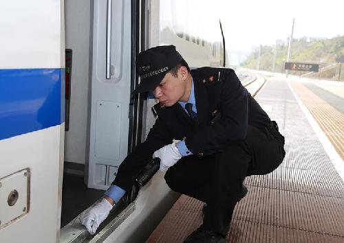 Attendants work in a standby bullet train
