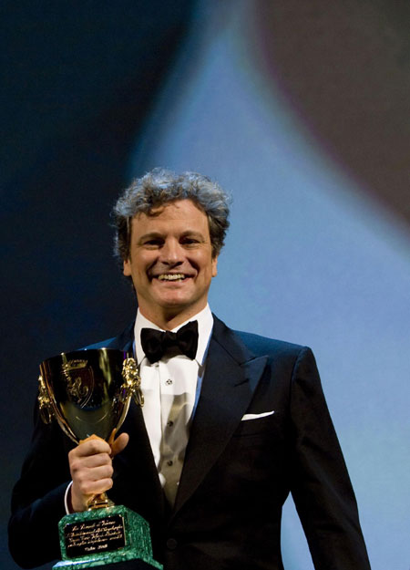 Actor Colin Firth holds the Coppa Volpi for Best Actor at 66th Venice