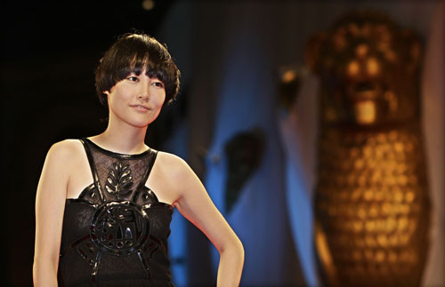 Kikuchi poses for photographers at the Venice film Festival