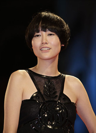 Kikuchi poses for photographers at the Venice film Festival