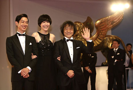 Kikuchi poses for photographers at the Venice film Festival