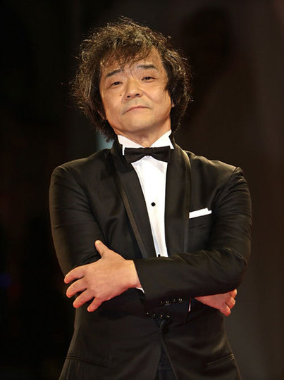 Kikuchi poses for photographers at the Venice film Festival