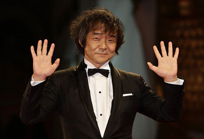 Kikuchi poses for photographers at the Venice film Festival