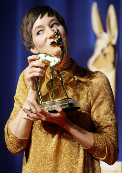 German actress Johanna Wokalek kisses her award