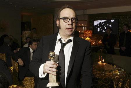 Paul Giamatti poses with his award at the Golden Globe awards' after party