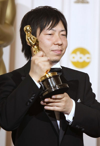 Kunio Kato holds his Oscar for best animated short film at Oscars