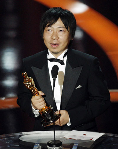 Kunio Kato holds his Oscar for best animated short film at Oscars