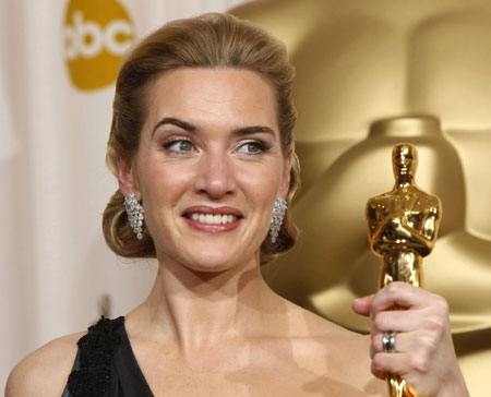 Kate Winslet holds her Oscar for best actress at Oscars