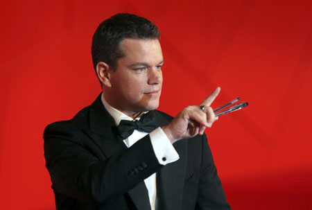 Matt Damon and his wife walk on the red carpet at the 66th Venice Film Festival