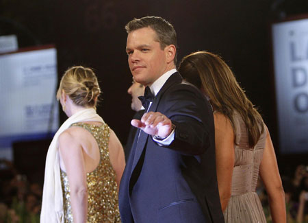 Matt Damon and his wife walk on the red carpet at the 66th Venice Film Festival