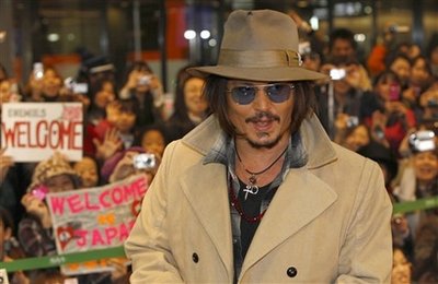  Depp promotes latest movie, but hasn't seen it